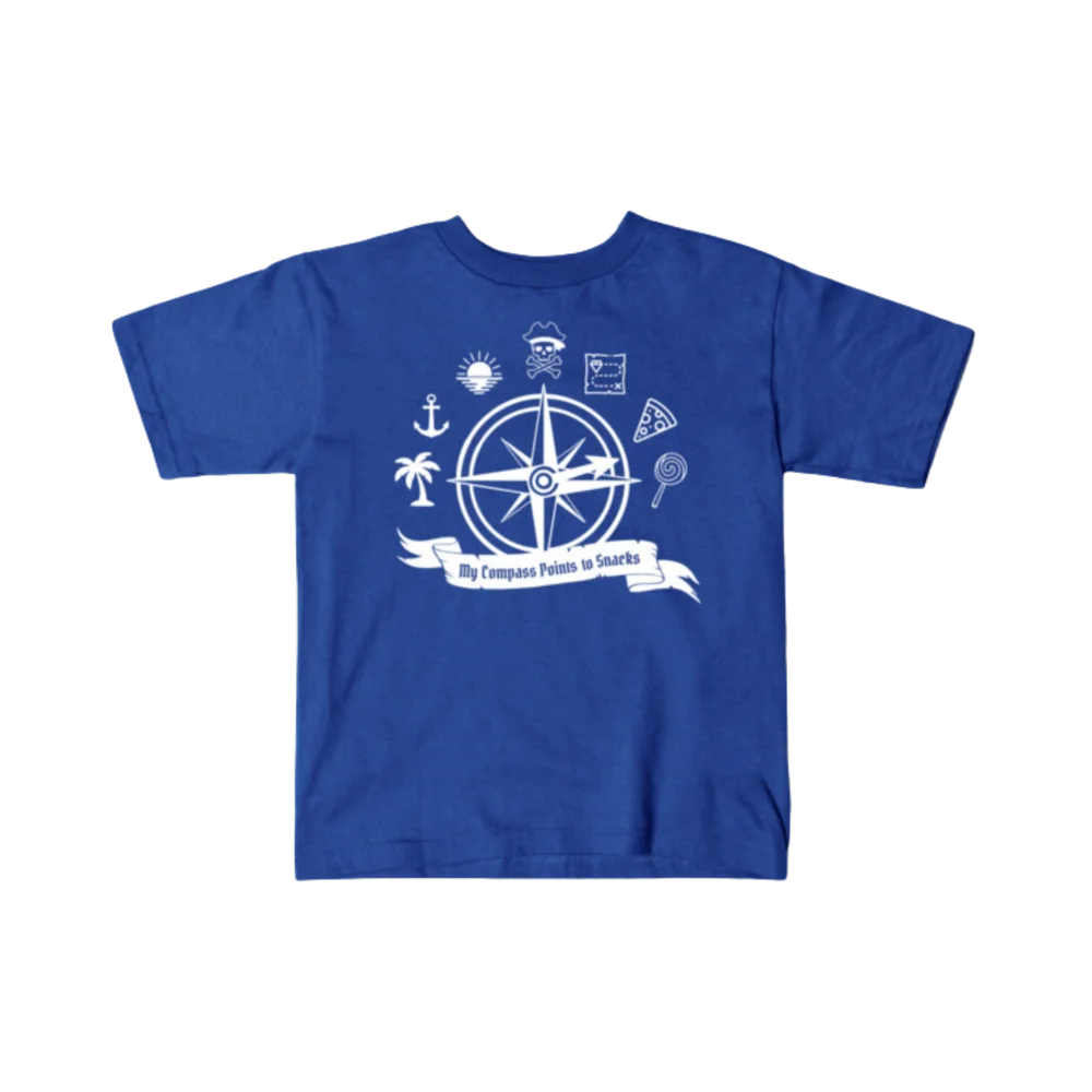 Royal blue kids t-shirt printed with the My Compass Points to Snacks design in white ink — a pirate-style compass rose surrounded by a skull and crossbones, treasure map, palm tree, pizza slice, and lollipop.