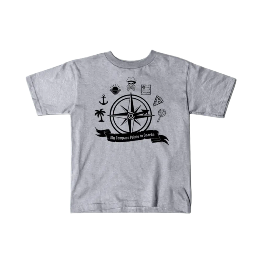 Heather gray kids t-shirt printed with the My Compass Points to Snacks design in black ink — a pirate-style compass rose surrounded by a skull and crossbones, treasure map, palm tree, pizza slice, and lollipop.